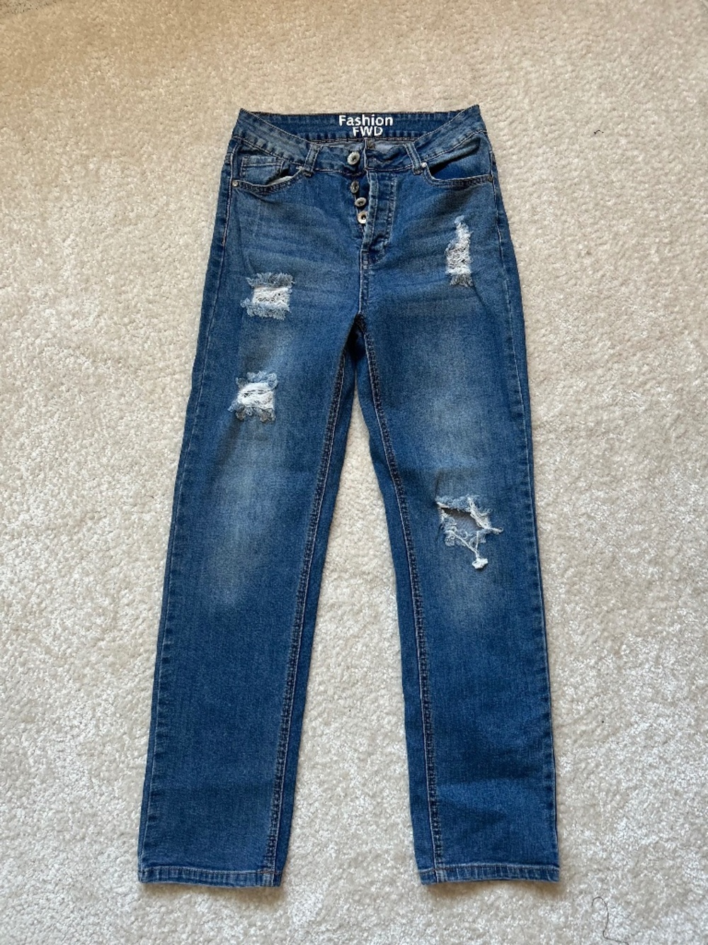 Chic high-rise distressed skinny jeans